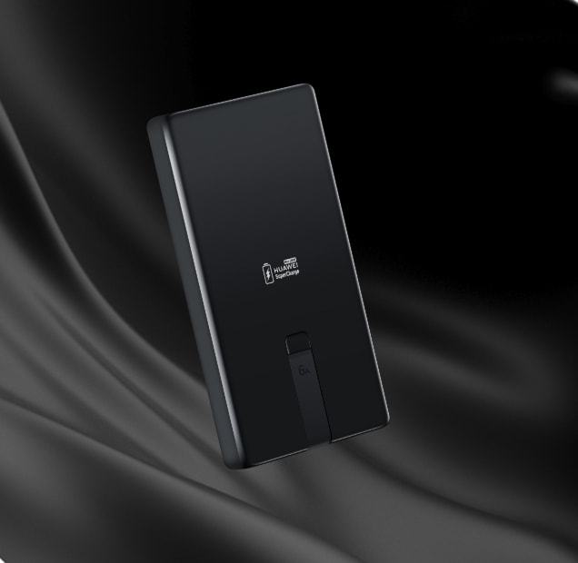 黑色华为自带线全能充移动电源(100 W 12000),展示了其轻快便携的特点