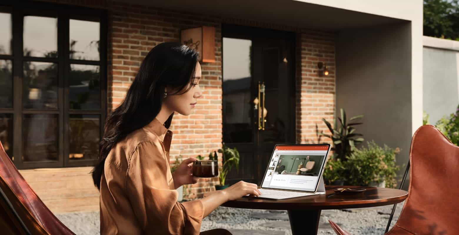 A woman is working with HUAWEI Glide Keyboard (Compatible with HUAWEI MatePad Pro 12.2-inch) in Laptop Form