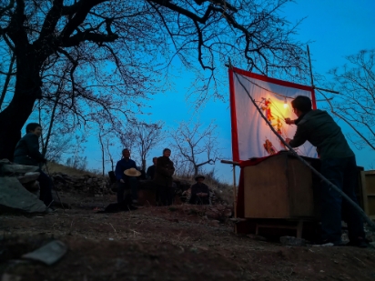 Shadow Puppetry on the Mountain Peak