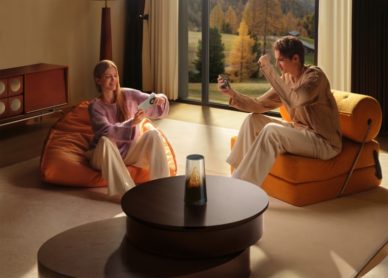 Displays a young man and woman playing smooth gaming on their phones with the HUAWEI WiFi Mesh X3 Pro placed on a tabletop in the living room, demonstrating the game acceleration feature of Huawei's self-developed Game Turbo engine.