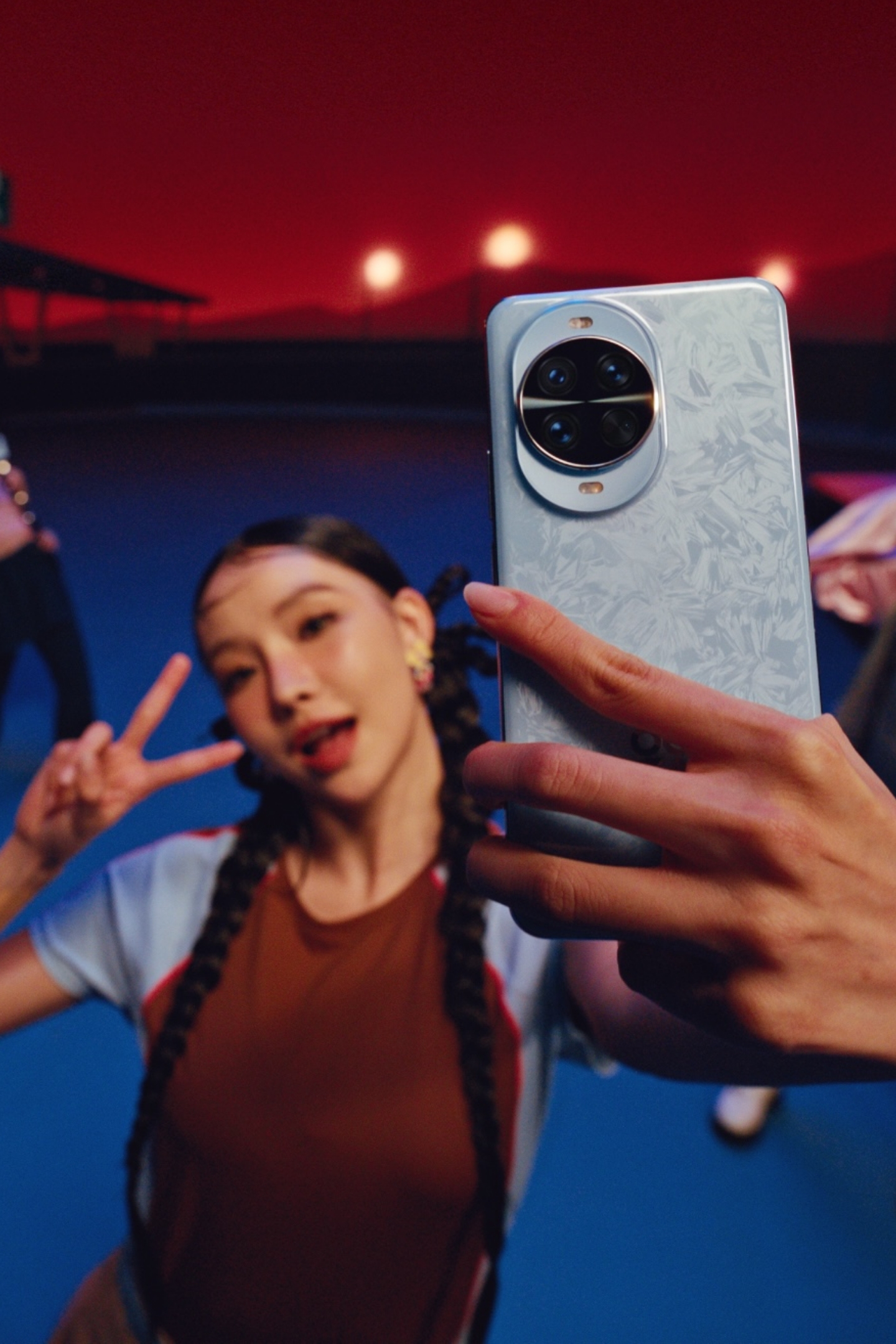 A female model using HUAWEI nova 14 Pro to take selfies, showing the comprehensive imaging capabilities of the device