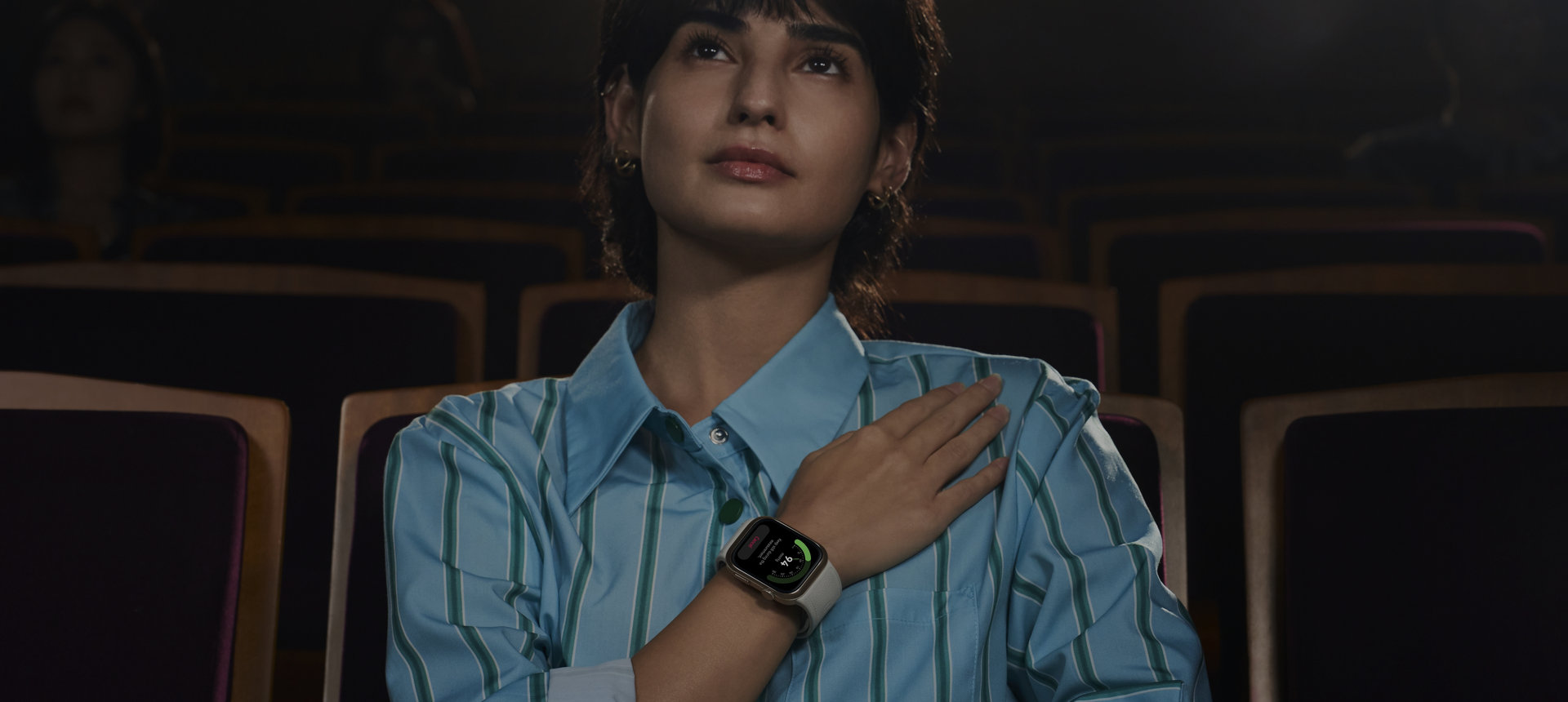 A female user wears HUAWEI Watch, and the watch screen displays cardiovascular health-related data